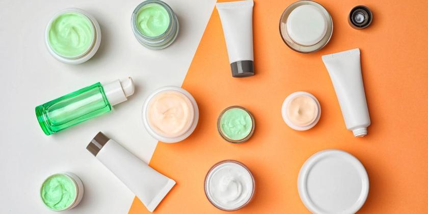 Flat lay composition with cosmetic products on color background